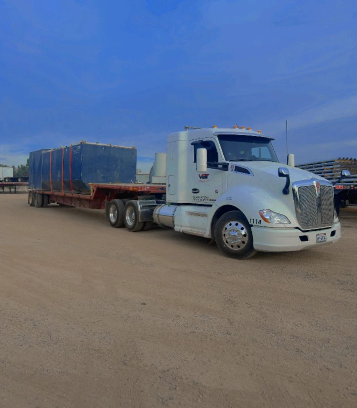Velazquez Bros truck with a crated load at dusk